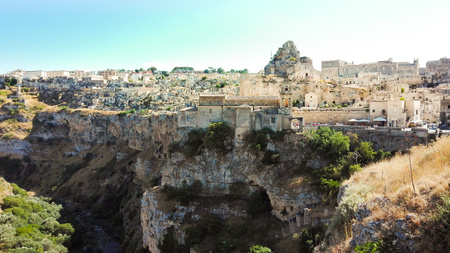 Crowded houses characteristic near the overhanging of the river of Matera also called City of the stones European Capital of Culture 2019の写真素材