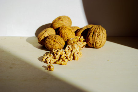 Group of walnuts open and closed illuminated from natural light of sun