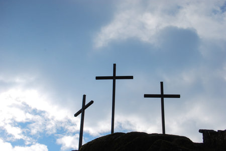 Crosses outdoor on the top of a high mountain with dark clouds