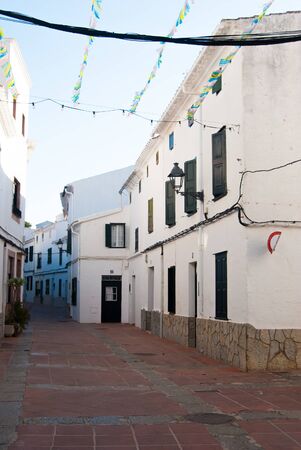 A little road with white houses of El Mercadal of the Spanish islandsの写真素材