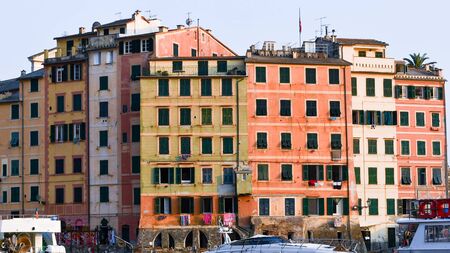 Buildings close to castle and church of a little town on the mediterranean sea in Liguriaの写真素材