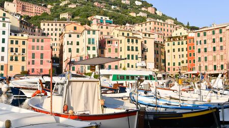 Typical boats and colourful houses of the coastal area on the Mediterranean Sea in northern Italyの写真素材