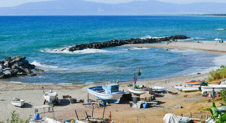 Panoramic view on the beach in front of the Pedigrotta church cave during a day with the rough seaの写真素材