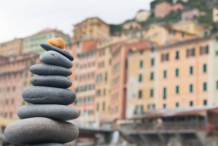 Grey stones in equilibrium in the beach of Camogli the small village in the north of Italyの写真素材