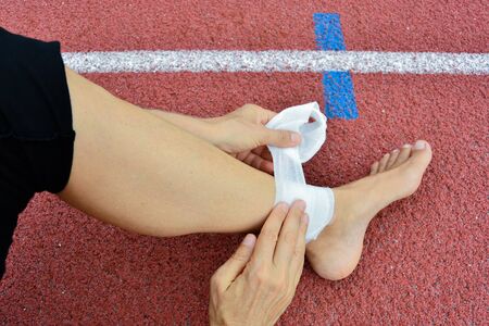 Athlete injured the leg during athletics trainingの写真素材