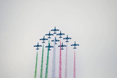 Ten old Frecce Tricolori in the air during a day with a little fogの写真素材