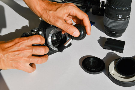 Photography instruments as camera body and lens and SD cards and photographic stand and ND filter on a white backgroundの写真素材