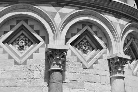 Geometric decorations with arches lines and Corinthian capitals of the famous Tuscan towerのeditorial素材