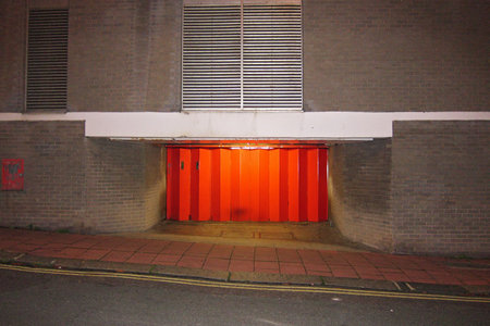 Brighton, United Kingdom - November 01, 2011: Red door on a streetの写真素材