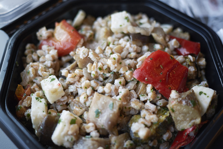 Salad with spelled, cheese and red peppersの写真素材