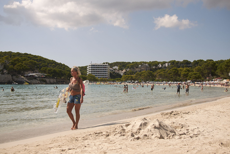 Minorca, Balearic Islands, Spain - September 05, 2013 : Tourists in Cala Galdana, Minorcaのeditorial素材