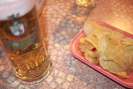 Rome, Italy - March 14, 2015 : Beer and chipsのeditorial素材
