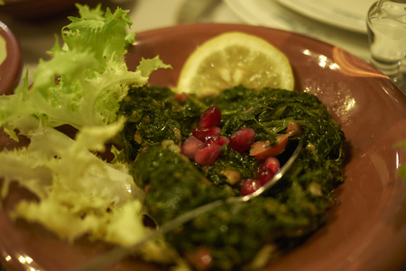 Spinach with pomegranate and carrotの写真素材