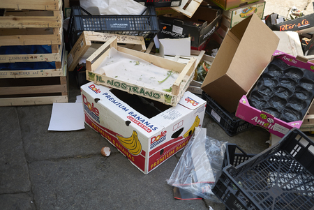 Milan, Italy - April 21, 2018: Empty fruit crtates in a street marketのeditorial素材
