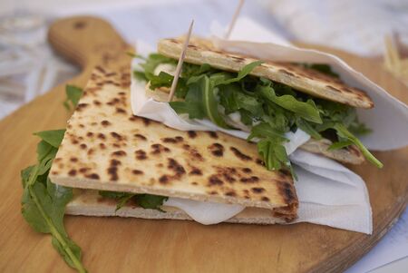 Piadina romagnola with rocket and cheeseの写真素材