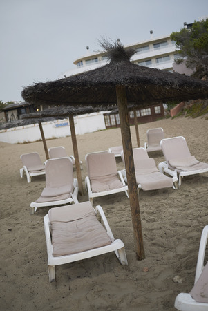 Ibiza, Spain - August 27, 2019  : Sunbeds in Cala Taridaのeditorial素材
