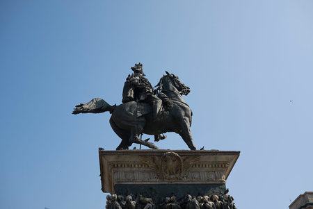 Milan, Italy - June 25, 2019 : View of Vittorio Emanuele II statue in piazza Duomo