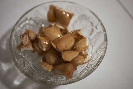 Almond brittle in a bowlの写真素材