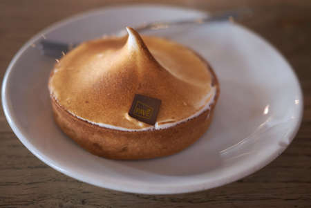 Milan, Italy - July 20, 2021: Lemon meringue served for lunchの写真素材