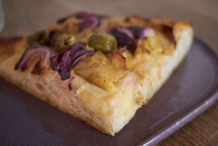 Focaccia with olives, potatoes and red onionの写真素材