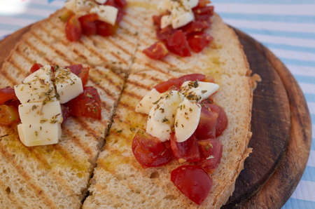 Bruschetta with mozzarella cheese and tomatoの写真素材