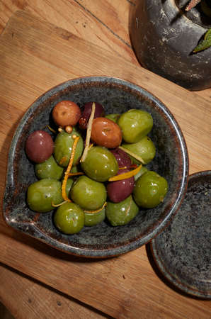 Olives with orange zest and spicesの写真素材