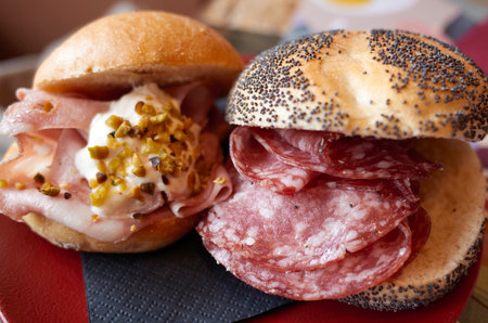 Sandwich with salami and mortadellaの写真素材