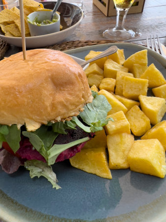 Veggie burger with chips and saladの写真素材