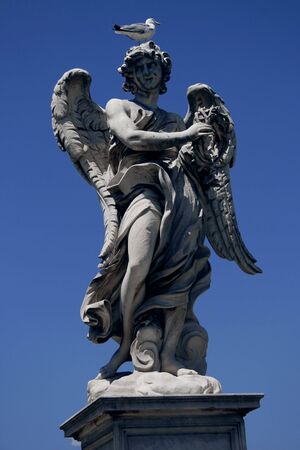 In the picture a seagull on a sculpture in Castel Santangelo, Romeの写真素材