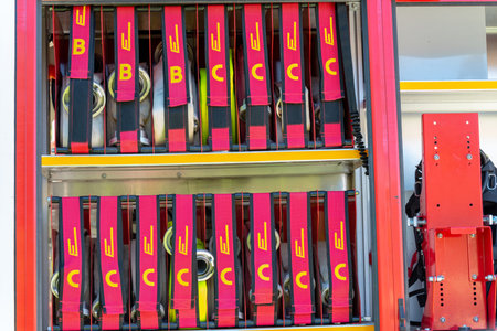 The side view of equipment packed neatly inside a fire engine, fire truck