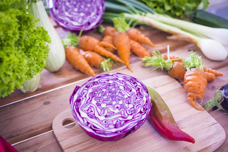 mixed colorful vegetables on the table ready to be eaten. vegetarian or vegan or healthy food choice of life, wellness and fitness conceptの写真素材