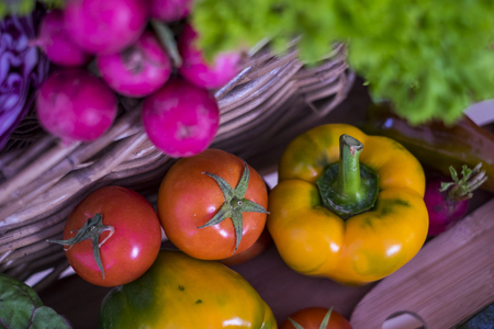 group of mixed vegetable ready for salades. colors and background for a natural raw food ready to been cooked at home for a healhty lunch or dinnerの写真素材