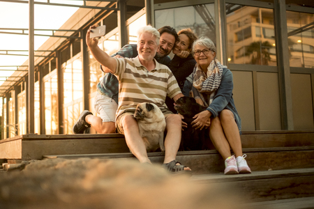 couple of middle aged and senior who spend time with their domestic dogsの写真素材