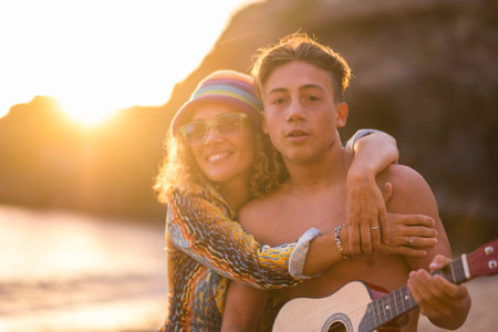 family leisure activity at the beach during a golden colored sunset in vacation and freedom...