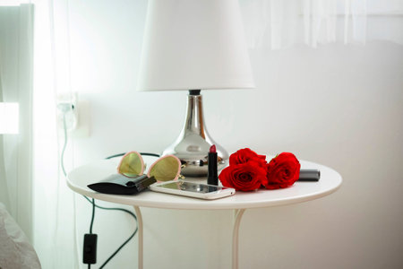 lipstick, roses, mobile phone at home to do a perfect woman world. sunglasses and females stuffs in...