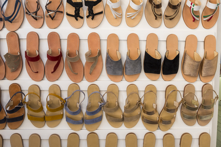 Shoes for a young woman, for daily summer use shown in a shop with huge variety of colors and model totally handmade by artisansの写真素材
