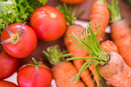 Clouse up of mixed colured vegetables like carots and tomatoes and salads with many colors and healthy lifestyle concept for diet and wellness. fresh food for nice life. vegetarian and vegan conceptの写真素材
