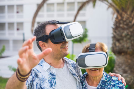 technology concept for no young people middle age and mature man and woman enjoying the outdoor...