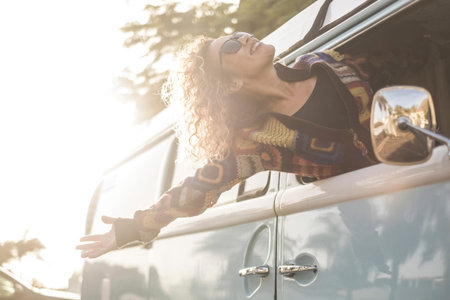 Happiness and freedom lifestyle concept with beautiful girl young caucasian female out of the...