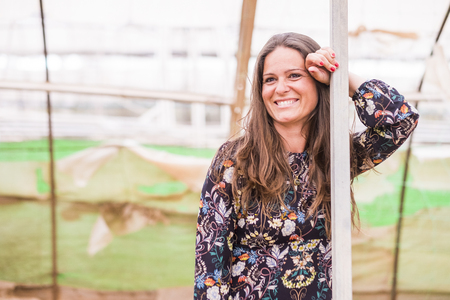 Youthful lady caucasian woman with long brown hair smile at the camera - diversity and alternative concept for young people - beautiful womanの写真素材