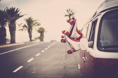 Two feet with roller outside the van windowの写真素材