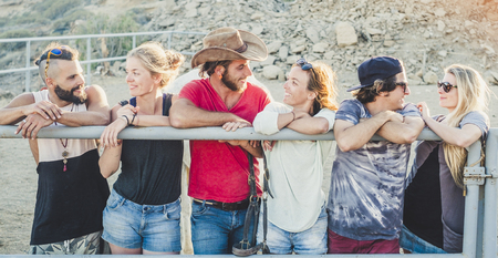 Group of diversity alternative millennial people young caucasian man and women staying together in friendship enjoying the day in outdoor leisure activity together -の写真素材