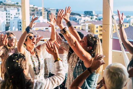 Group of happy young people caucasian women with terndy fashion clothes celebrate together with a...