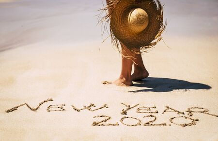 New year eve celebration and start with new life and adventure concept with people in tropical beach under a nice sun enjoying the lifestyle and be happyの写真素材
