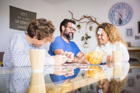 Concept of happy caucasian family at home have fun during coronavirus lockdown quarantine - stay home and enjoy life playing together fathers and sonsの写真素材