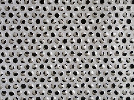 Holes in sheet steelの写真素材