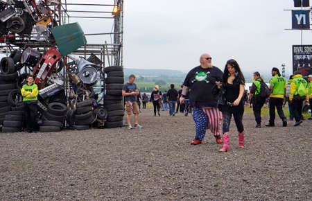 Grossly overweight man at an outdoor festival.のeditorial素材