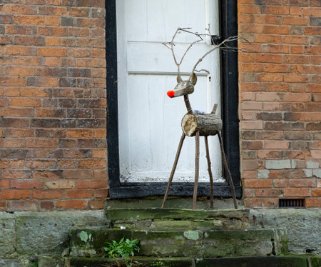 Wooden Christmas reindeer on a doorstepの写真素材