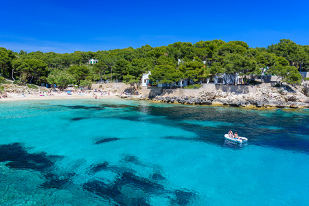 Sailing boat at cala Ratjada, Mallorca - beautiful beach and coastの写真素材