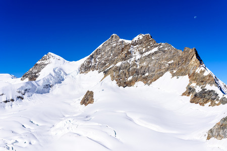 Jungfrau mountain - View of the mountain Jungfrau in the Bernese Alps in Switzerland - travel destination in Europeの写真素材